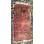 A Belouch rug, the charcoal field with five linked serrated medallions, within multiple borders,