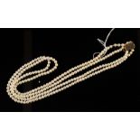 A double strand pearl necklace with 9ct gold clasp.