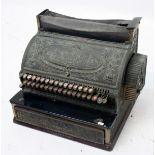 An American brass cash register, inscribed 'National Cash Register Company, Dayton, Ohio',