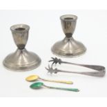 A pair of Duchin Creation weighted silver candlesticks,