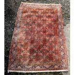 A Bidjar rug, the madder field with the all over herati pattern,