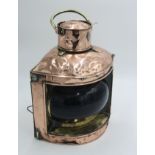 A copper navigation lamp, starboard, circa 1900, height 33cm.