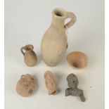 A Roman pottery flask, with loop handle, height 25cm, an early Phoenician jug, height 10cm,