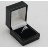 A platinum diamond set ring, the principal stone of cushion cut measuring 2.