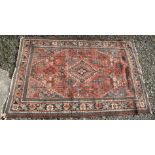 A North West Persian rug, the madder field with the herati pattern,