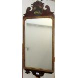 A George lll mahogany and gilt decorated wall mirror,