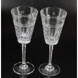 A set of six cut wine glasses with tapered bowls and hexagonal stems, height 23cm.