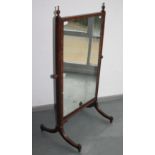 A mahogany cheval mirror, height 136cm, width 75cm.