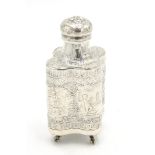 A continental silver quatrefoil section lidded bottle on four claw and ball feet,