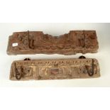 Two Indian carved oak coat hooks, width 38.5 and 42cm.