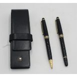 A Mont Blanc Meisterstuck black and gilt ballpoint pen, together with a matching Meisterstuck pen,