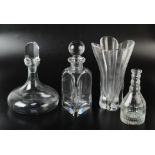 A contemporary glass ship's decanter, a contemporary triangular section decanter,