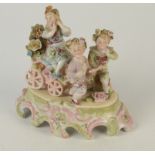 A continental porcelain group of three children with a hand cart, late 19th century, height 20cm,