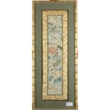 A Chinese silk embroidered rectangular panel decorated with fish and flowers, 67.5 x 27.5cm.