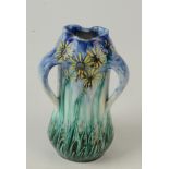 An Art Nouveau Amphora pottery vase, with three handles and tube work decoration, height 17.