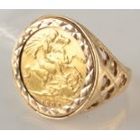 A 9ct. gold ring set an Edward VII 1903 half sovereign, 7.8g.
