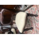A set of six Victorian mahogany balloon back dining chairs,