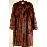 A ladies' three-quarter length red fur coat by Rosco, size 10/12, length 40cm.
