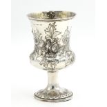 A bellied silver trophy cup by Edward Joseph with acanthus repousse decoration and vacant cartouche,
