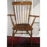 An elm and beech spindle back kitchen chair, 19th century, height 109cm, width 62cm.