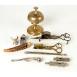 A brass servants bell, collection of whistles and two pairs of candle snuffers.