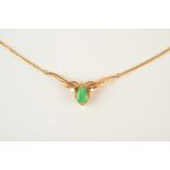 An 18ct gold post war necklace set with jade and a small diamond, 9.8g.
