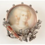 A Russian style gold brooch set a painted portrait miniature of an 18th century beauty,