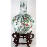 A large Chinese porcelain vase, 20th century, decorated with fruiting peach branches, height 56cm,