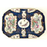 An 18th century Worcester scale blue ground rectangular shaped dish with principal panels of exotic