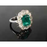 A fine and impressive emerald and diamond cluster ring,