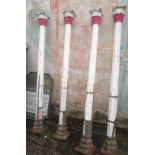 A set of four cast iron pillars of octagonal section,