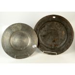 Two large 18th century pewter chargers, each with touch marks, diameters 42.5cm and 37cm.