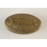 A brass oval pocket snuff box crudely inscribed John Williams, 1903, Dunvant.
