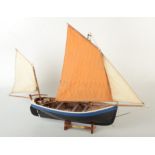 A scratch built model boat, Tenby Lugger, hull length 40cm.