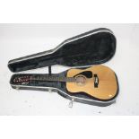 A Yamaha FG-411-12 twelve string acoustic guitar, made in Taiwan, length 107cm, cased.