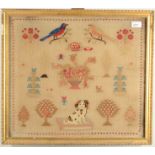 A Victorian woolwork panel, worked in coloured threads with two birds, a spaniel and plants,
