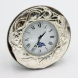 A silver mounted timepiece the dial with lunar arch.