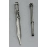 A silver propelling pencil/letter opener,