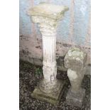 A reconstituted stone garden pillar with fluted column and figural base, height 73cm,