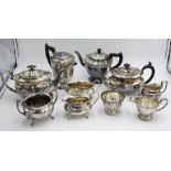 A four piece tea service and two three piece tea services.