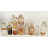 A collection of glass apothecary jars.