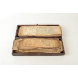 A large quantity of Islamic manuscripts, in a rectangular mahogany box, size 14 x 37.5cm.