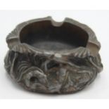 An Art Nouveau lead ashtray, stamped 'The Ashweighter Philip Robson patented Dec 15 1908',