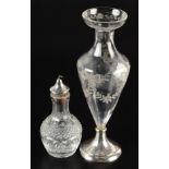 A cut glass vinegar bottle of pear form with dissimilar silver mounted pourer,