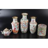 Three Chinese canton vases, a cylindrical jar and cover and a teapot.