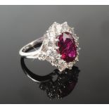 A good modern ruby and diamond cluster ring, the central Madagascan ruby approximately 2.