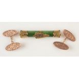 A New Zealand green stone gold mounted bar brooch and a pair of 9ct gold engraved cufflinks.