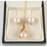 A 9ct gold pendant set a diamond and a cultured pearl on chain,