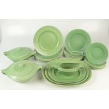 A Wedgwood green dinner service, with tureens designed by Keith Murray, comprising sauce boat,