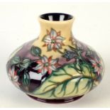 A Moorcroft pottery `Herb Garden Borage` pattern vase, shape 32, by Philip Gibson,